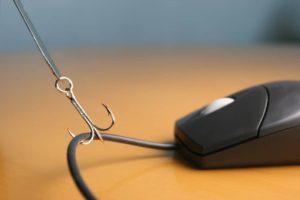 fish hook on computer mouse representing phishing