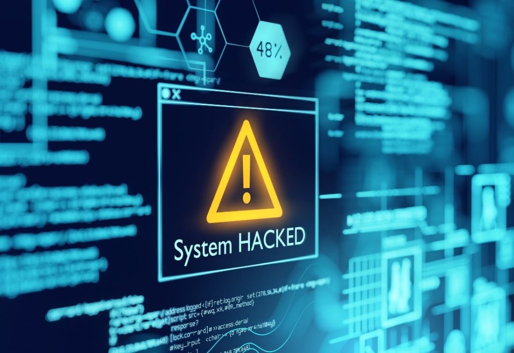computer screen with system hacked alert representing top 10 cyber attacks