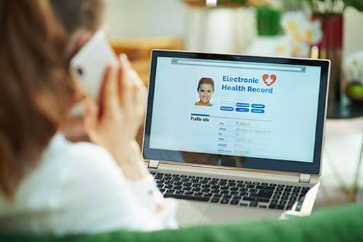 employee working with health records on computer