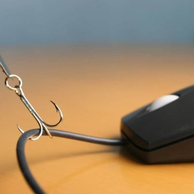 Phishing fish hook on computer mouse representing phishing